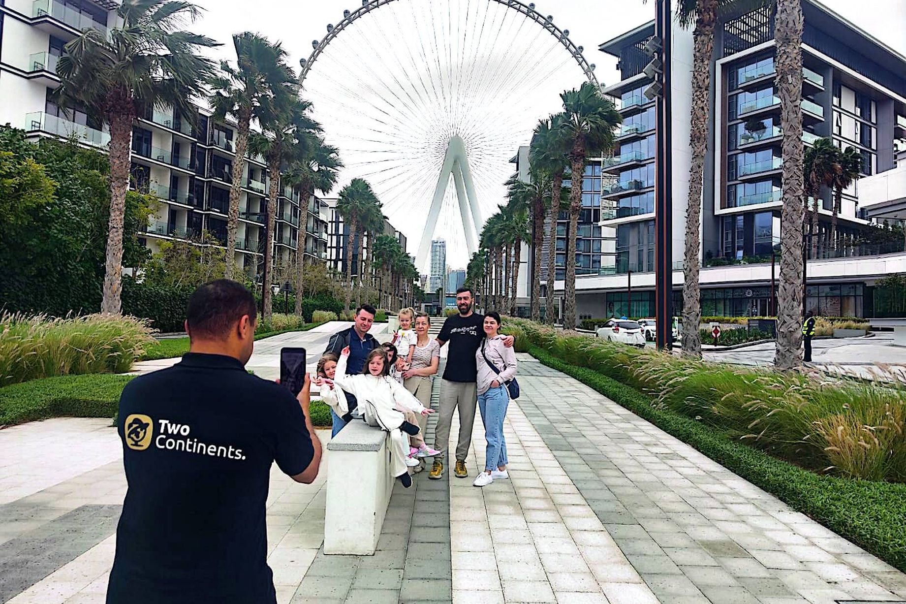 A lineup of four branded 'Safari' SUVs parked on a golden sand dune under a clear, bright blue sky.